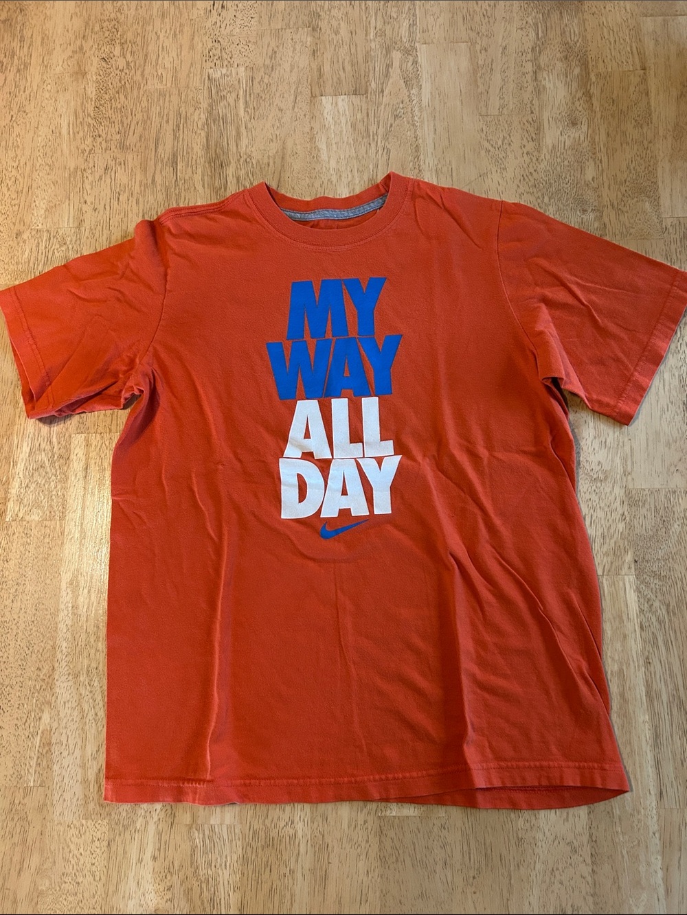 Nike Orange Short-Sleeve Graphic Tee with Blue and White Print